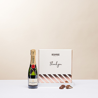 La combinaison classique du champagne et des chocolats belges est le geste parfait d'expression de votre gratitude. Tout le monde appréciera le luxueux champagne Moët Imperial et le délicieux chocolat belge Neuhaus dans un coffret cadeau spécial "Merci".