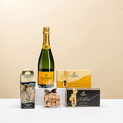 Impressionnez-les avec l'association emblématique du champagne Veuve Clicquot Brut et des chocolats Godiva de luxe. Ce délicieux cadeau à base de champagne et de chocolat est très apprécié, que ce soit pour l'offrir ou pour le recevoir.