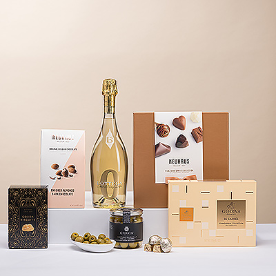 Découvrez l'ultime collection de snacks salés européens et de chocolats belges. Une bouteille festive de vin mousseux sans alcool Bottega Zero White accompagne les produits gastronomiques.