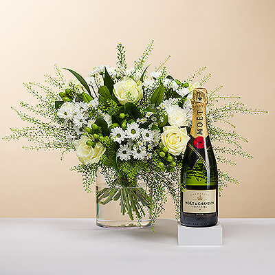Aussi beau qu&#39;un diamant, nous vous présentons cet élégant bouquet tout blanc. 
Le bouquet est accompagné d&#39;une bouteille de champagne Moët & Chandon pour une expérience cadeau délicieuse.