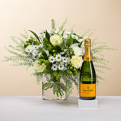 Aussi beau qu'un diamant, nous vous présentons cet élégant bouquet tout blanc. 
Le bouquet est accompagné d'une bouteille de champagne Veuve Clicquot Brut pour une expérience cadeau inoubliable.