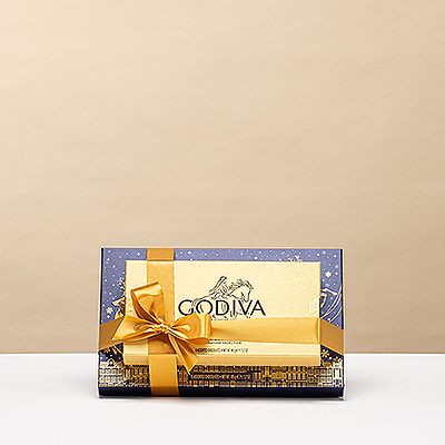 Deux coffrets emblématiques Godiva réunis dans une tour festive — un cadeau raffiné qui allie tradition belge et esprit de Noël.