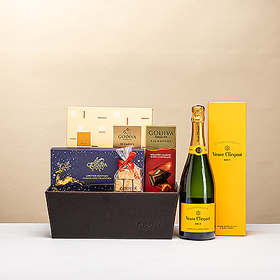 Pour Noël, gâtez-les avec un magnifique coffret de chocolat Godiva et du champagne Veuve Clicquot!