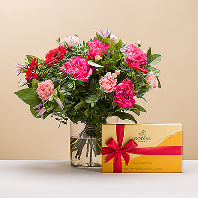 Think Pink avec notre bouquet Pretty in Pink avec chocolat Godiva ! C'est le cadeau idéal pour un anniversaire, la fête des mères, une naissance ou une fête.