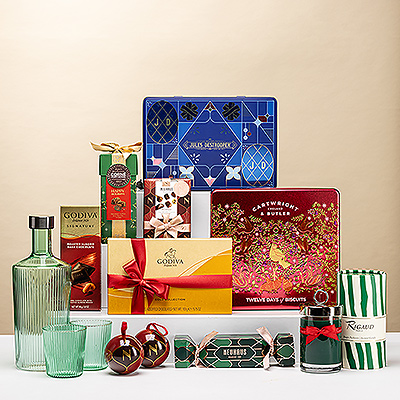 Coffret de Noël luxueux avec chocolats, truffes, biscuits et bougie parfumée. Le cadeau idéal pour une fête élégante.