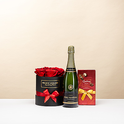 Offrez un moment de pur plaisir. Ce coffret noir luxueux associe de magnifiques roses rouges stabilisées, les célèbres chocolats Guylian et une bouteille de mousseux raffiné Pere Ventura. Le cadeau idéal pour témoigner votre affection de la plus belle des manières.